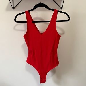 Red V-neck ribbed bodysuit